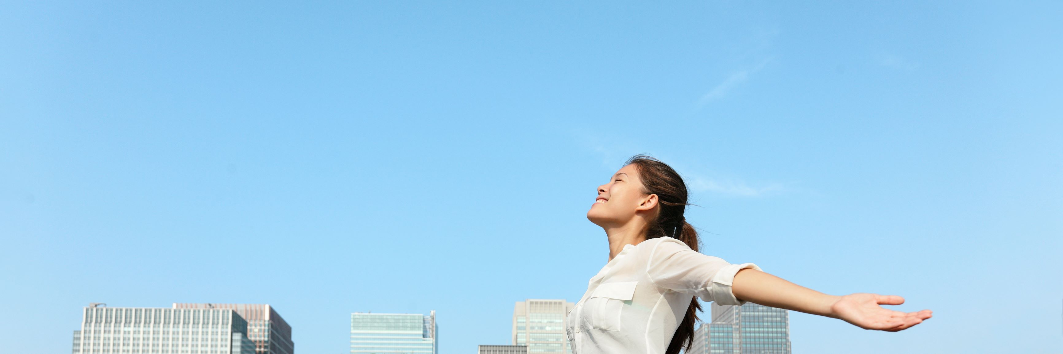 photo of blue skies, buildings woman
